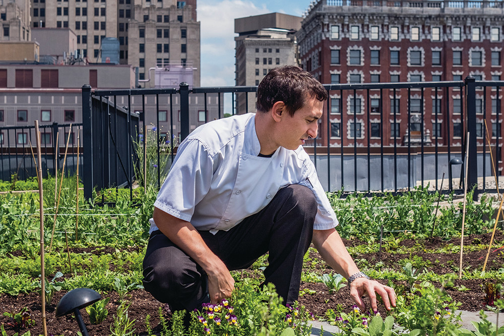 Chef Matthew Varga at work in Gracie's downtown rooftop garden