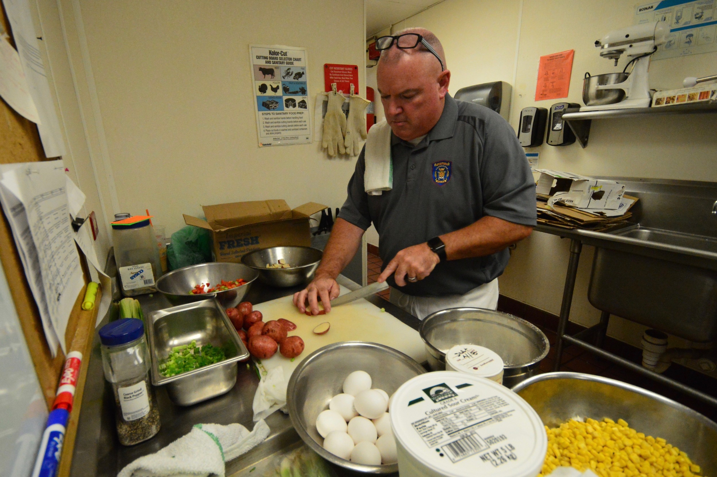 Police Patrolman Jack Clarke dices potatoes for his corn chowder. Under this year’s rules, each recipe had to feature corn as an ingredient.