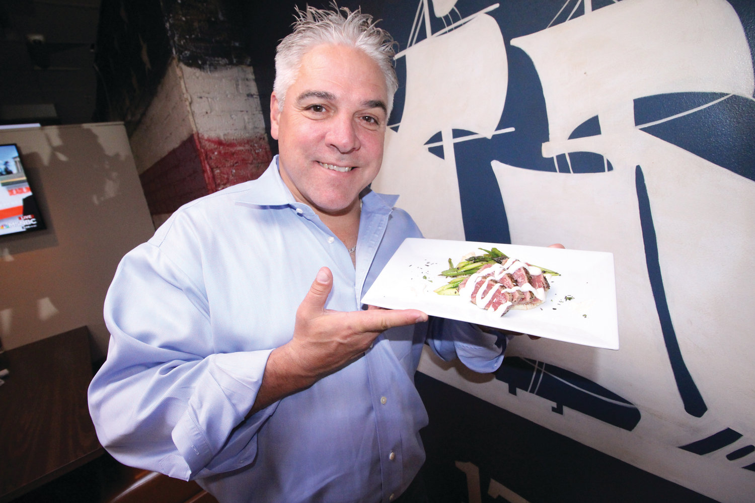 WHAT’S PLANNED AT REVOLUTION: When Dean Scanlon was asked what he planned to serve for the Taste of Pawtuxet, he escorted us to the kitchen where in a matter of minutes he prepared the “mini” steak dinner with asparagus  and a dollop of mashed potatoes he’ll be offering.