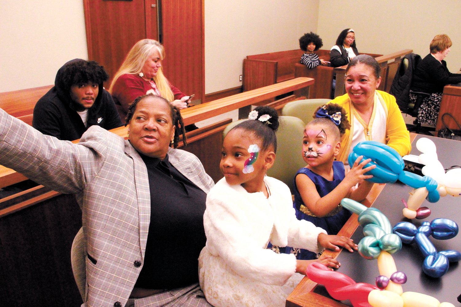 A COURTROOM SELFIE:  Wanda Smith gabs a selfie of her daughter Leia, Marilee Smith  and Lillybelly Brown on arriving in the courtroom Saturday.