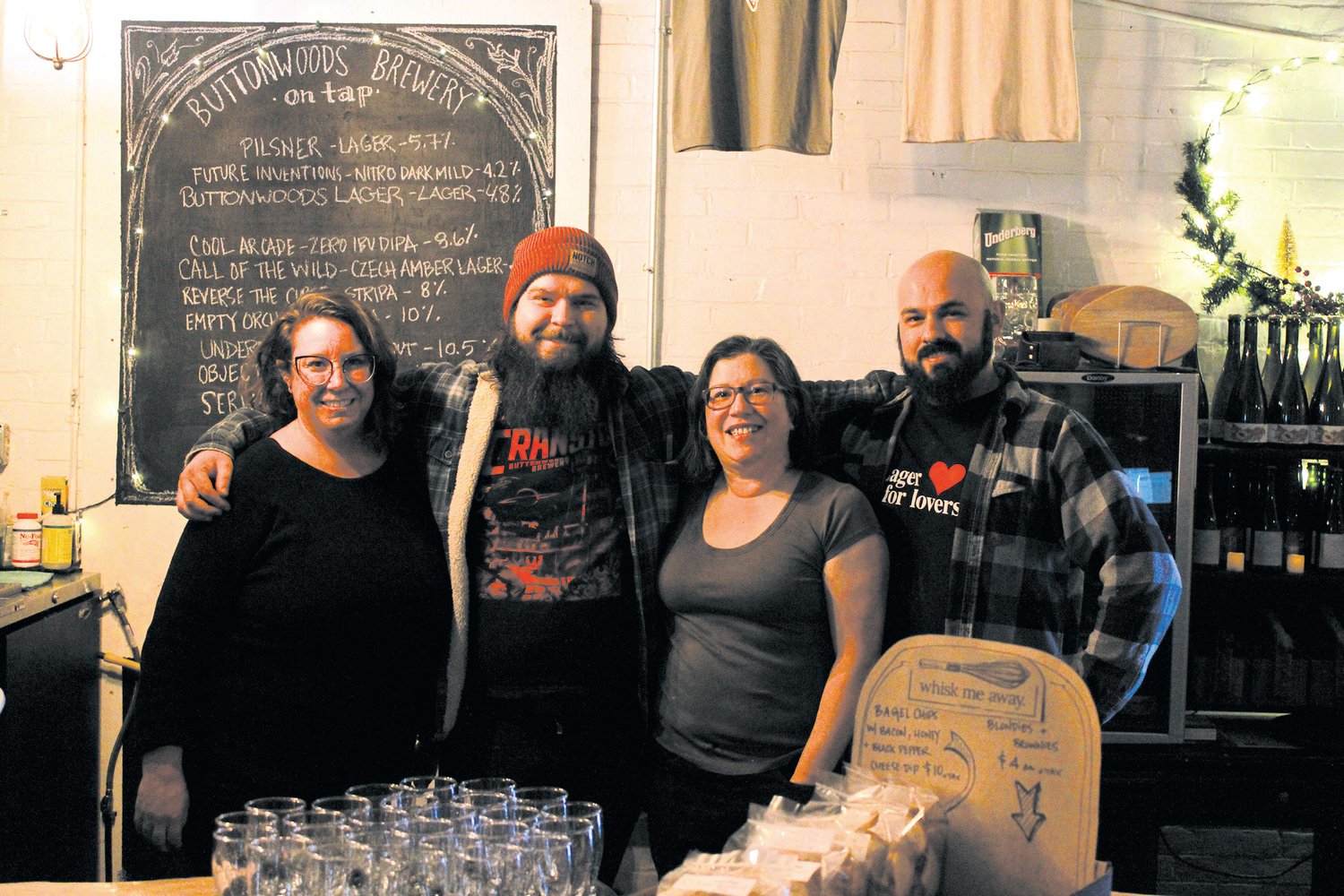 POSING WITH PRIDE: Tasting Room Manager Jennie Paquin, Brewer Morgan Snyder Jr, Cheese Shop Owner Adrienne D’Arconte and Bartender Sean Fitts Celebrate another successful beer and cheese tasting.