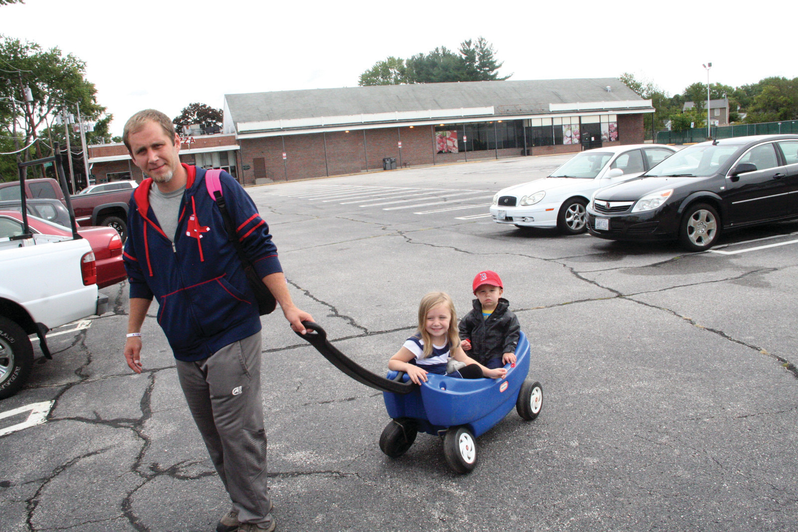 â€˜NICE TO HAVE AN OPTIONâ€™: Greg Phillips, who lives in the neighborhood of the planned Daveâ€™s Marketplace, knows the property well, as he worked there when it was a Hi-Lo market. He has in tow his daughter, Bella, a pre-schooler at Little Shepard across Pontiac Avenue from the proposed store, and his son, J.J., who is two years old.
