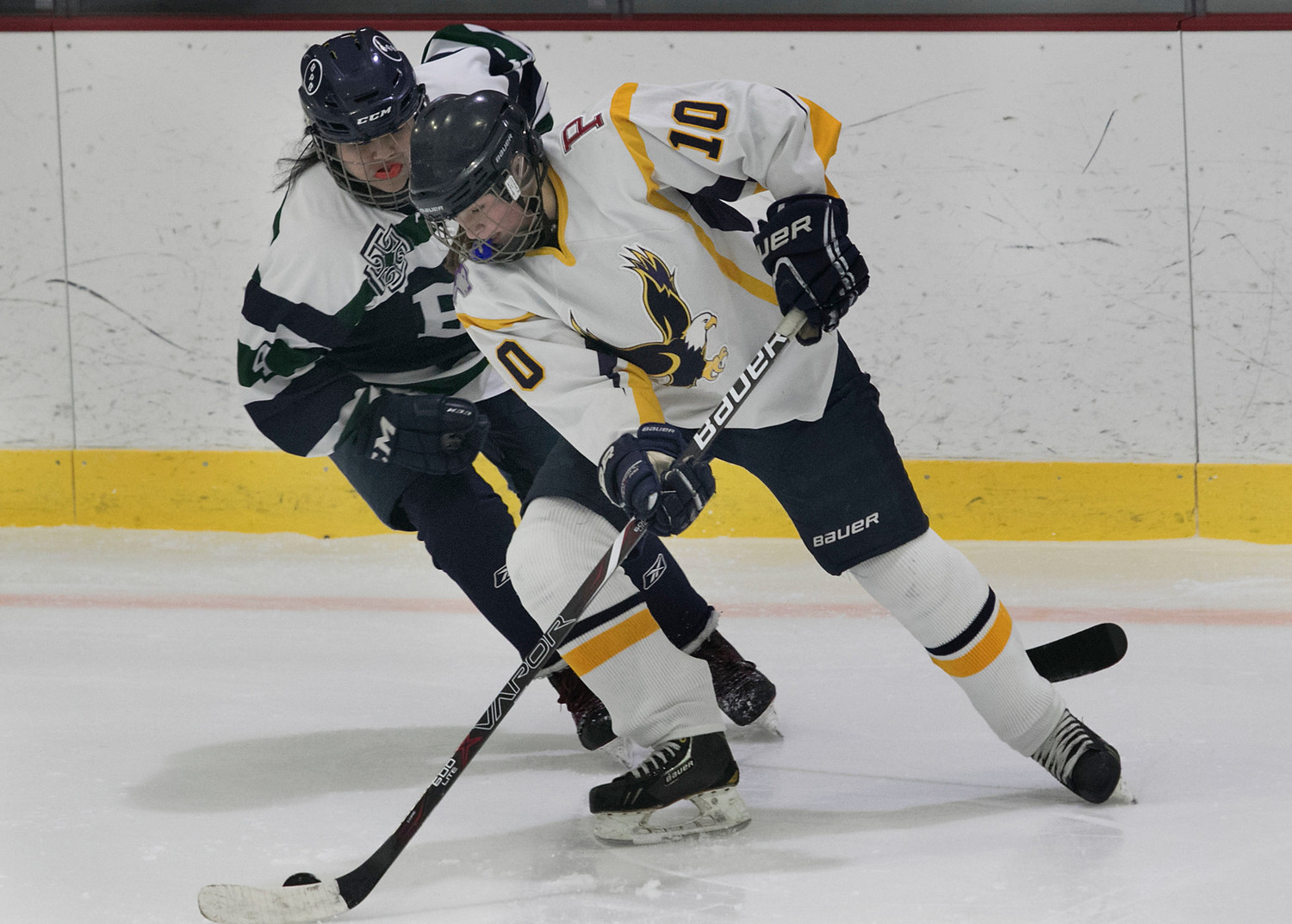 East Bay defenseman Madelyn Cox skates the puck into the offensive zone. She scored a goal and assisted on another during the game.