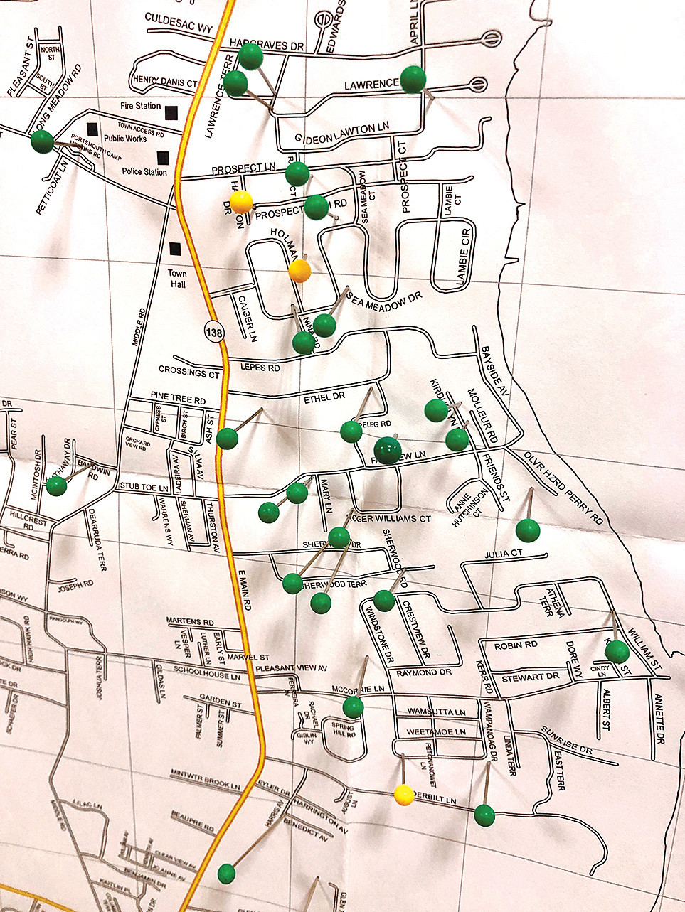 On this Portsmouth street map set up at Town Hall Tuesday, green pins mark several neighborhoods where police have received reports of coyote sightings. The yellow pins represent sightings added by residents who attended the meeting. There were also white pins to mark sightings of injured coyotes, and red pins that represented reports of confrontations between coyotes and dogs.