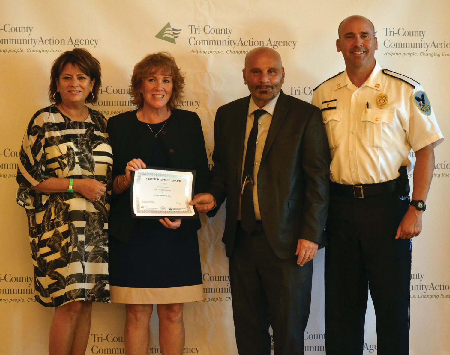 PROUD RECIPIENTS: Above, Tri-County COO Brenda Dowlatshahi (far left) and Johnston Police Capt. Christopher Correia (far right) accepted their grant from Department of Behaviorial Health, Developmental Disabilities and Hospitals Rebecca Boss (second left) and Tri-County President and CEO Joseph DeSantis.