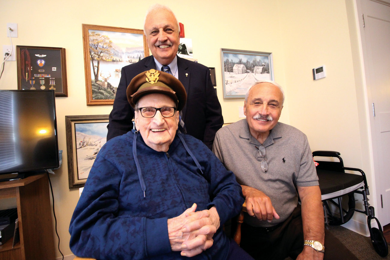 FATHER AND SONS: William Diman, now a resident at Brentwood Assisted Living, and his sons, Kenneth (standing) and William as they joined last week to celebrate his 100th birthday.