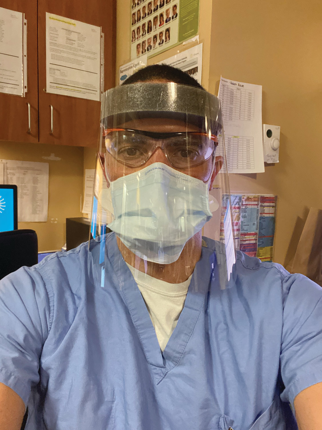 TAKING WORDS TO HEART:  Dr. Luke Messac, seen here geared up for work at Rhode Island Hospital, recently shared a 13-year-old email response from NIH Director Dr. Anthony Fauci. Fauci praised Messac’s thesis and said he was confident he would go on to have a successful career. (Submitted photo courtesy Luke Messac)